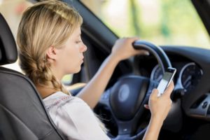 Woman Texting whilst Driving